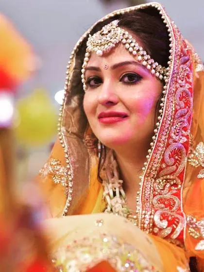 A beautiful candid portrait of a bride during her wedding ceremony, with soft, warm lighting.