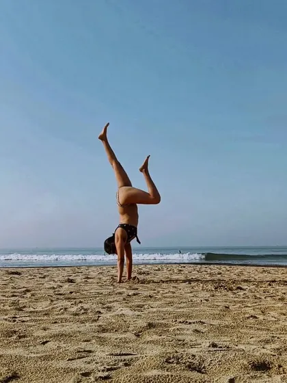We are all superhumans unlocking our superpowers. For me, practicing handstands on the beach is a way to tap into that inner strength and playfulness.