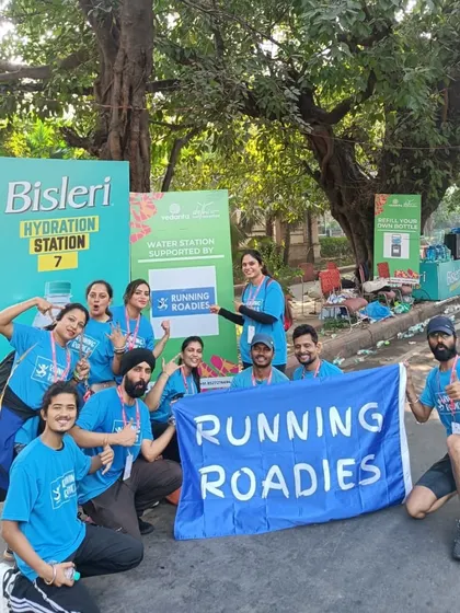 Our team posing at the Bisleri Hydration Station during the Delhi Half Marathon. We are experienced in managing official water stations for large-scale running events.