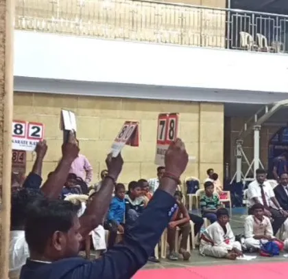 The judges' scores being held up during the state-level competition. This moment of judgment is what every competitor trains for.