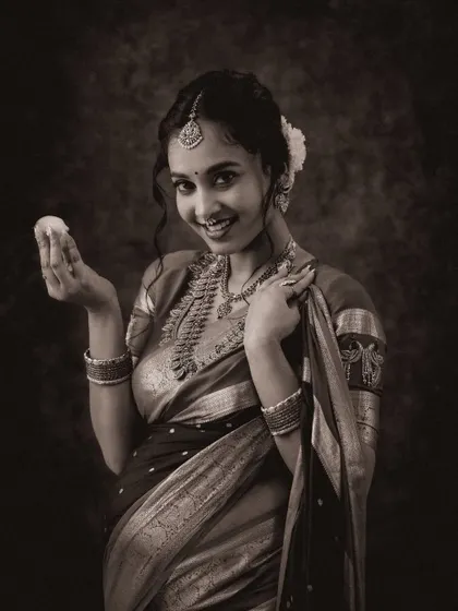 A classic black and white version of a traditional portrait. The monochrome effect adds a timeless and artistic quality, focusing on expression and texture.