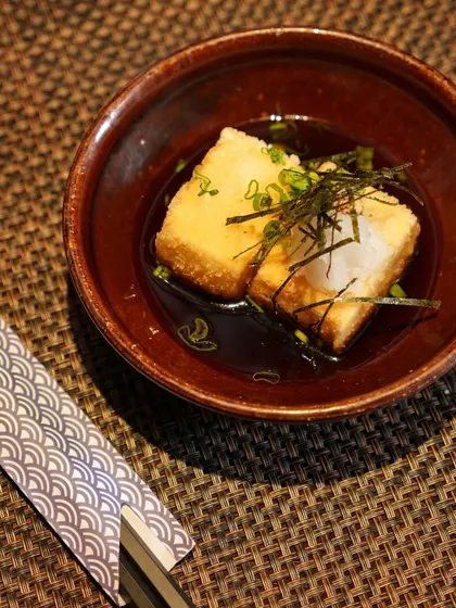 A quiet moment with a bowl of our Agedashi Tofu. The combination of the hot, savory broth and the soft, crispy tofu is the definition of Japanese comfort food.