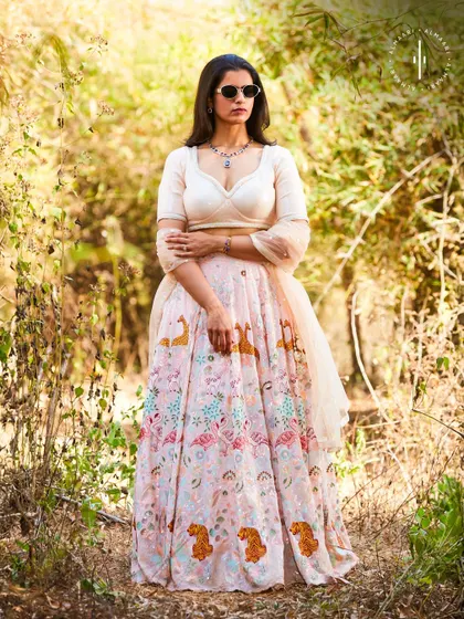For a softer, more whimsical vibe, this pastel lehenga with unique animal motifs is a conversation starter. It's perfect for a day wedding or an outdoor event.