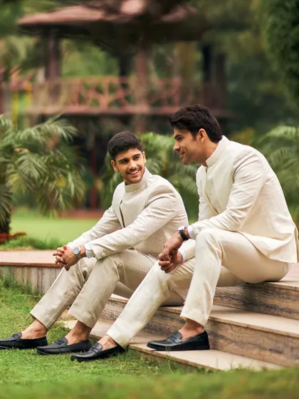 For a friend's summer wedding, coordinated ivory Jodhpuri suits are a perfect choice. I use light, breathable fabrics and tailor each piece for a bespoke fit, ensuring the entire groom squad looks sharp and feels comfortable.