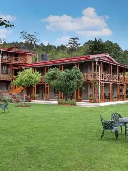 The exterior of the Chevron Eco Lodge in Kausani, Uttarakhand. The design uses local stone and extensive woodwork to create a building that is in harmony with its natural mountain setting.
