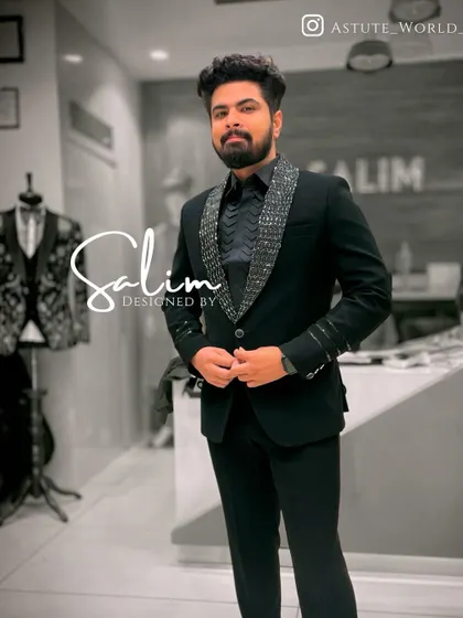 A client in a black blazer with a sequined lapel and cuff detail. The matching black shirt creates a sleek, all-black look that is very popular for evening events.