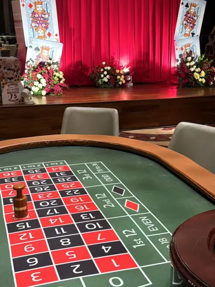 The roulette table is always a crowd-pleaser. Here, it's set up and ready for guests to try their luck, adding a dynamic and interactive element to the party.