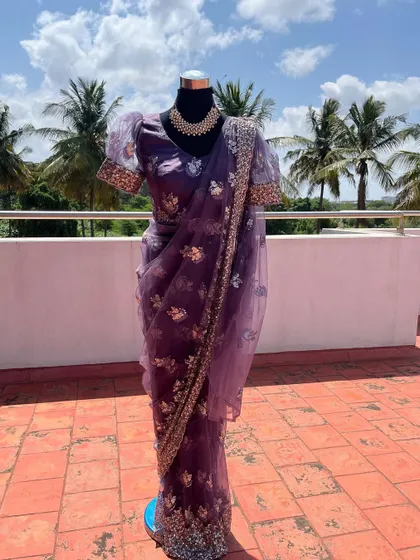 The full view of the purple ready-to-wear saree with puff sleeves.
