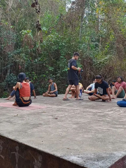A yoga session in progress in a serene, open air setting at the farm. These workshops are perfect for warming up, cooling down, and improving flexibility and focus.