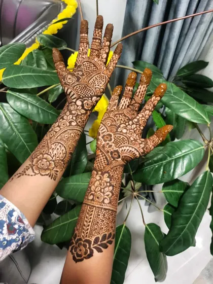 A full view of both hands, showcasing the complementary yet distinct patterns.