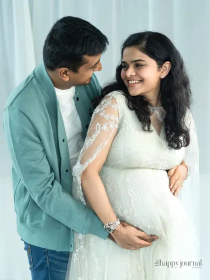 A bright and happy portrait of a couple sharing a smile. Their genuine affection for each other shines through in this simple and beautiful shot.
