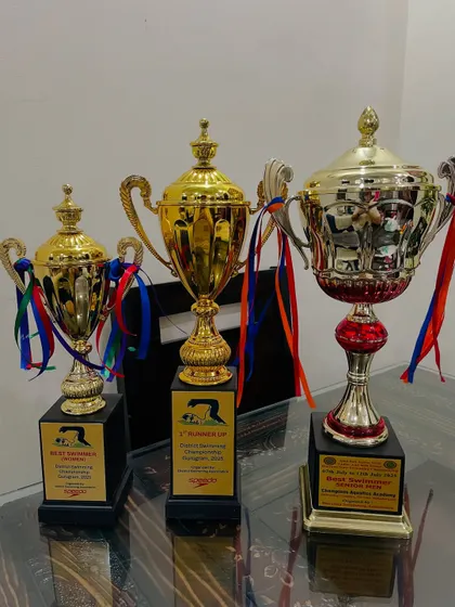 A glimpse of the hardware my swimmers have earned. These trophies represent countless hours of dedication and are a testament to our results-driven training approach at state and district level championships.