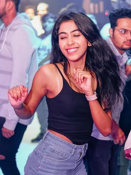 A duplicate of the smiling guest, a perfect representation of the night's mood.