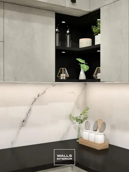 This shot highlights the clean lines and seamless finish of the grey cement-textured cabinets, paired with a white marble-look backsplash and under-cabinet LED strip lighting.