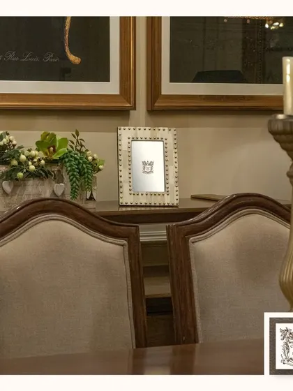 This photo frame, with its neutral, earthy tones, creates a harmonious look in this dining space. It's a small detail that helps make the room feel warm, inviting, and well-coordinated.