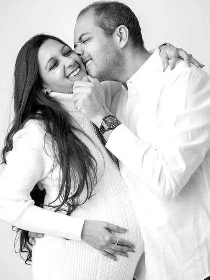 Pure joy and laughter! This playful moment shows the fun and happiness that fills my studio during a couple's maternity session.