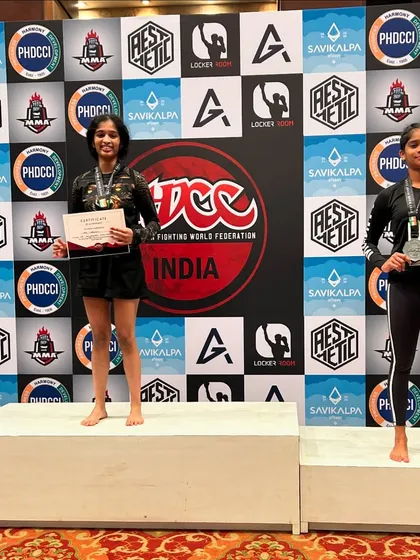 Aditi stands proudly on the podium after winning gold at the ADCC India tournament. Champions are built through daily effort, and she is a shining example of that principle.