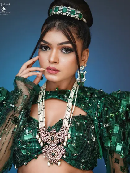 A high-fashion look with a bold green outfit and dramatic makeup. This shows the creative range you'll develop.