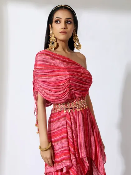 A modern ethnic look from the fashion shoot. The makeup is contemporary, with glowing skin and a simple hairstyle.