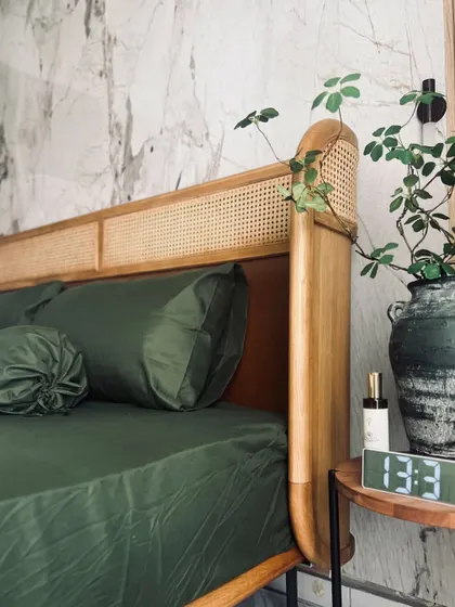 A corner view of the Tierra Bed, showing how the natural oak and rattan headboard creates a warm and inviting atmosphere. It’s the perfect backdrop for creating your own personal, serene retreat.