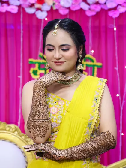 A close-up of the bride's face, showing the soft and glowing makeup.