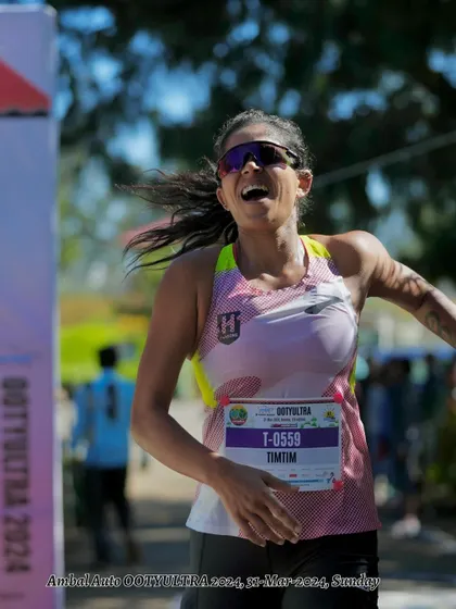 The pure joy and exhaustion at the finish line of the Ooty Ultra. This is the face of someone who left it all out there.