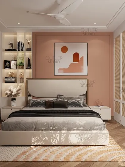 This bedroom uses a warm peach accent wall and natural wood tones to create a cozy and inviting space. The built-in backlit shelving adds a place for personal trophies and decor.