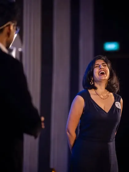 A guest laughing uncontrollably on stage with me. My interactive routines are all about creating fun, shared experiences.