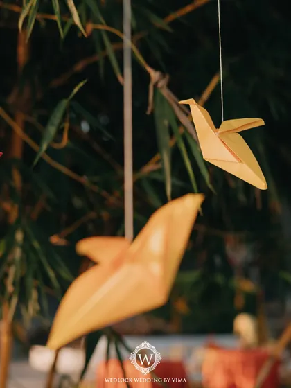 This Haldi ceremony was a burst of color and unforgettable moments. We used vibrant tissue flowers, playful origami birds, and colorful smoke bombs to bring the venue to life.