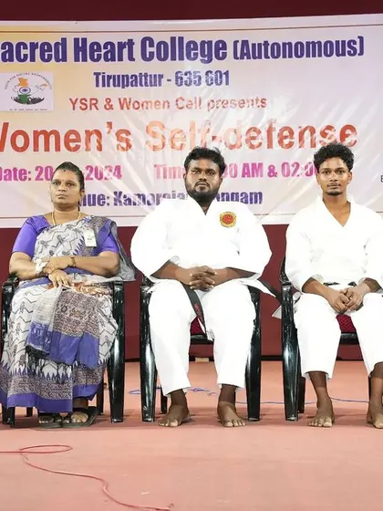A photo on stage with the organizing committee and Manikandan Master at Sacred Heart College. It was an honor to be invited as a special guest for this important event.