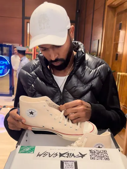 We had the opportunity to present Indian cricketer Hardik Pandya with his own custom Converse sneakers. He's seen here inspecting the final product, a moment that captures the personal and exclusive nature of our work.