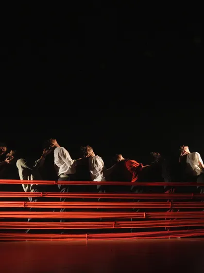 A stunning visual from one of our stage productions, where dancers use the architecture of the set to create powerful and evocative imagery.