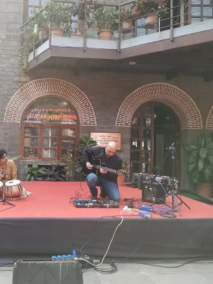 An impromptu guest performance at the College of Engineering, Pune. Here I am jamming with a guitarist on stage.