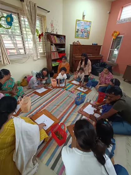 A duplicate shot showing the focused engagement during the nature craft activity.