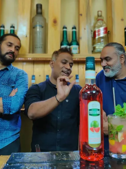 The devil is in the details. Here I am with fellow experts, discussing the finer points of a watermelon cocktail made with premium syrups.