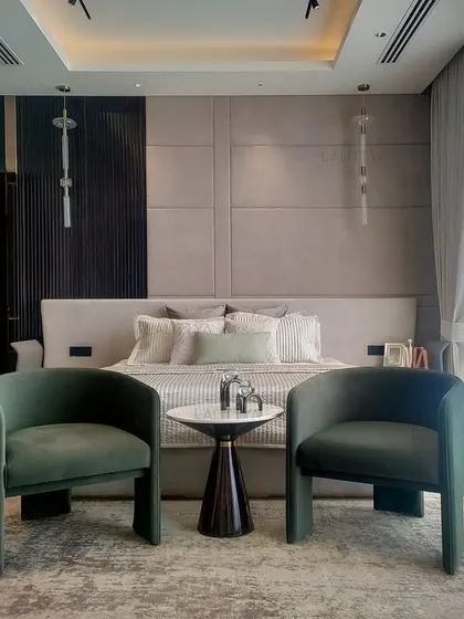 A beautifully appointed bedroom showcasing our signature style of quiet luxury. This space combines layered textures, a soothing color palette, and bespoke furniture to create a personal sanctuary for rest and relaxation.