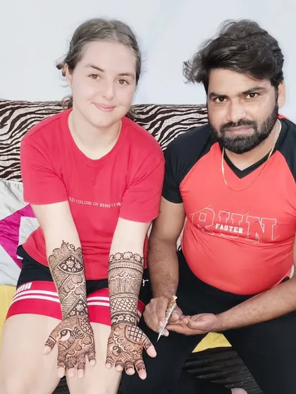 I am happy to serve clients from all over the world for their weddings in Mumbai. Here is a happy international client showing her full-arm traditional Indian mehandi.