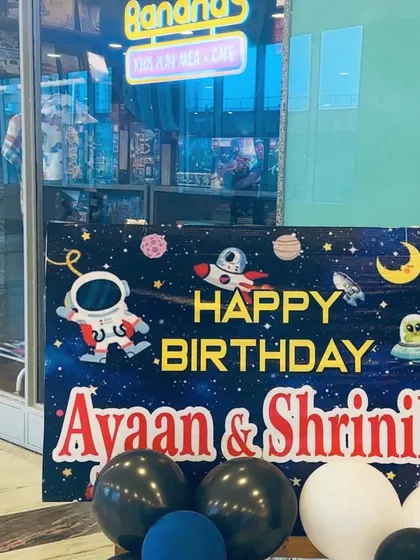 Welcome, little astronauts. This custom space-themed welcome sign for Ayaan and Shrinika's joint birthday party set the tone for an interstellar adventure right from the entrance.