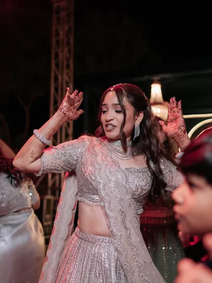 Another candid from the dance floor. Her makeup remains impeccable, proving that you can have fun without worrying about touch-ups.