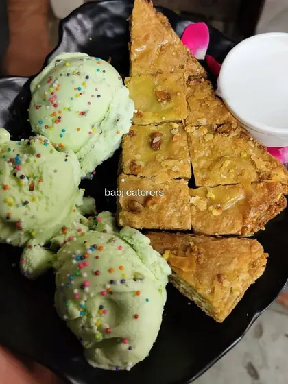 A delightful combination of Pistachio Baklava and Pista Vanilla ice cream. The flaky, nutty pastry pairs perfectly with the cool, creamy ice cream.