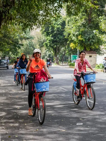 Two friends enjoying a ride together, with one giving a peace sign. It's all about good vibes and creating happy memories.