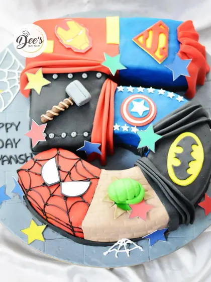 This superhero number cake is the ultimate mashup. It combines iconic symbols from Superman, Batman, Spider-Man, Hulk, Thor, and Iron Man into a cake shaped like the number four.