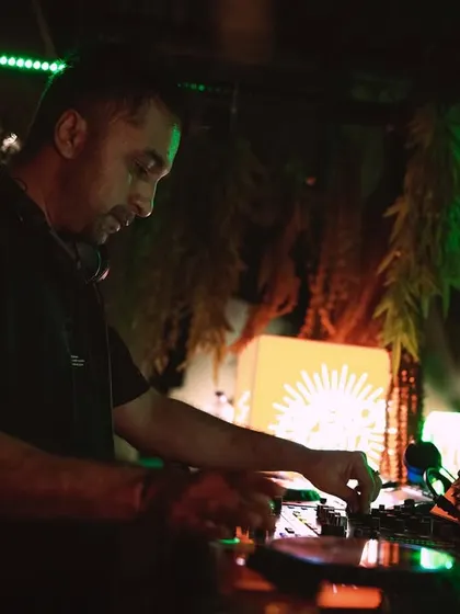 In the zone, mixing tracks at the Goifornia party. The green and orange lighting created a cool, tropical vibe.