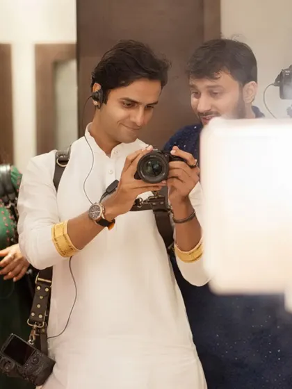 My team and I work closely on every shoot. Here, we are discussing the framing and lighting for the next shot. This teamwork is essential to ensuring a smooth, creative, and enjoyable pre-wedding photoshoot experience for you.