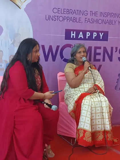 Dr. Indu Gupta being interviewed at the Women's Day event, sharing her insights on fashion education and women empowerment.
