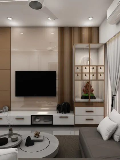 We integrated a glass-encased pooja mandir into this living room's TV unit, providing a divine corner that is both visible and elegantly partitioned.
