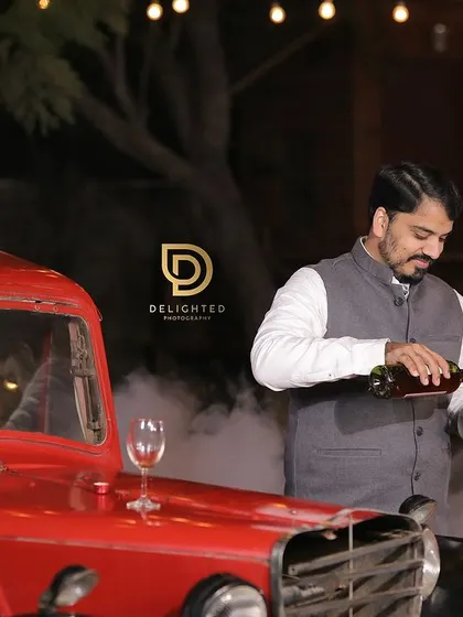 To add a touch of classic romance to their pre-wedding shoot, we brought in a vintage red car. The smoky, atmospheric lighting at night created a dramatic and cinematic scene.