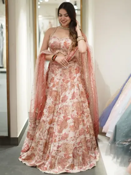 Who needs a filter when the outfit brings the glow? This printed lehenga with a sequined border and a halter neck blouse is effortlessly beautiful.