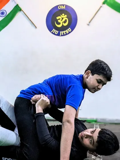 Practice until it becomes second nature. Two of our young students drill a grappling position, building muscle memory and a deep understanding of Jiu-Jitsu principles.