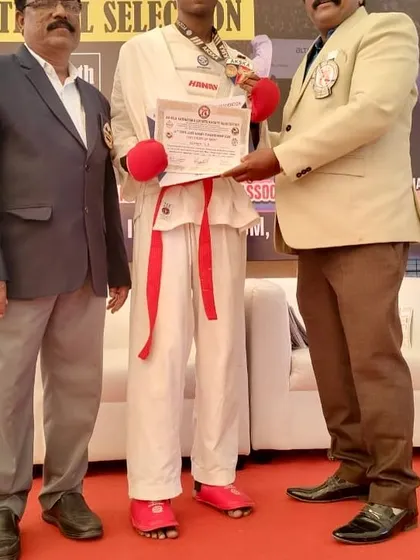 A proud moment for a UMC athlete, receiving his award after a successful performance at the state level competition.